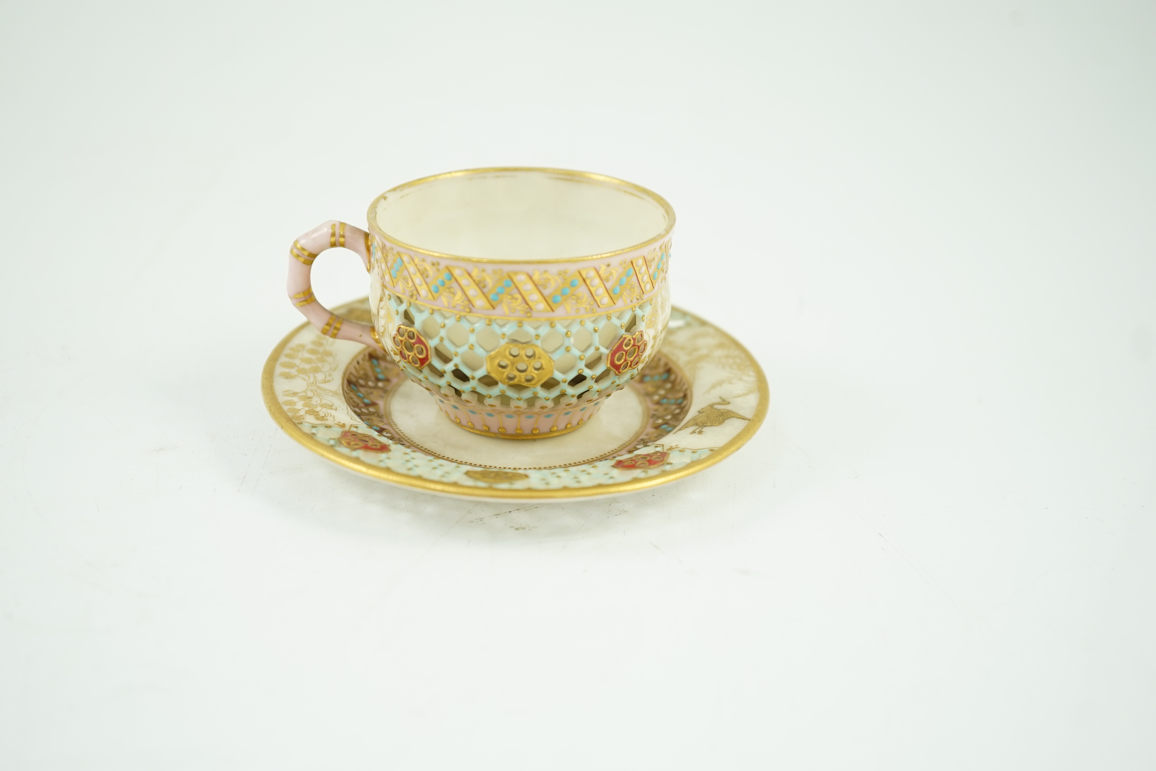 A Royal Worcester reticulated miniature cabinet cup and saucer, late 19th century